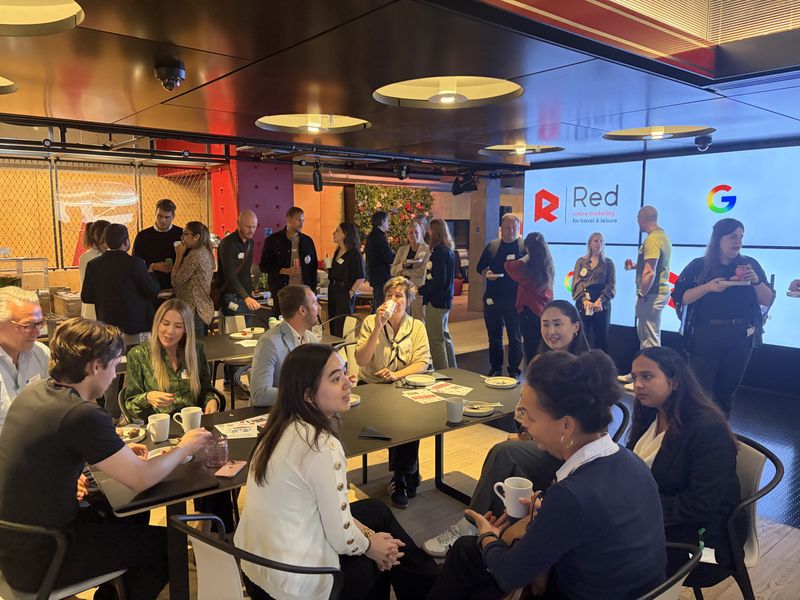 Attendees at tables during Online Marketing in the AI Era at Google's London office, with Red Online Marketing and Google branding on the screens