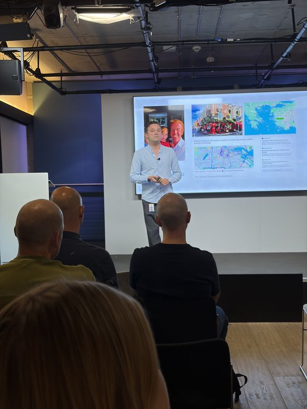 Kamil Tavas of Google on stage at Google London presenting travel insights and activation